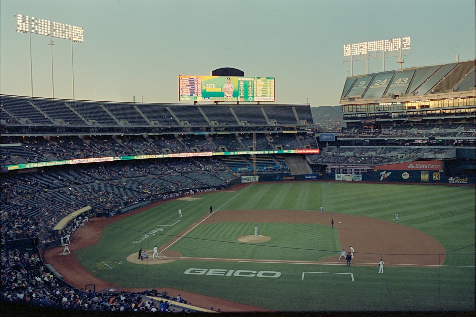 A baseball stadium under the lights at night