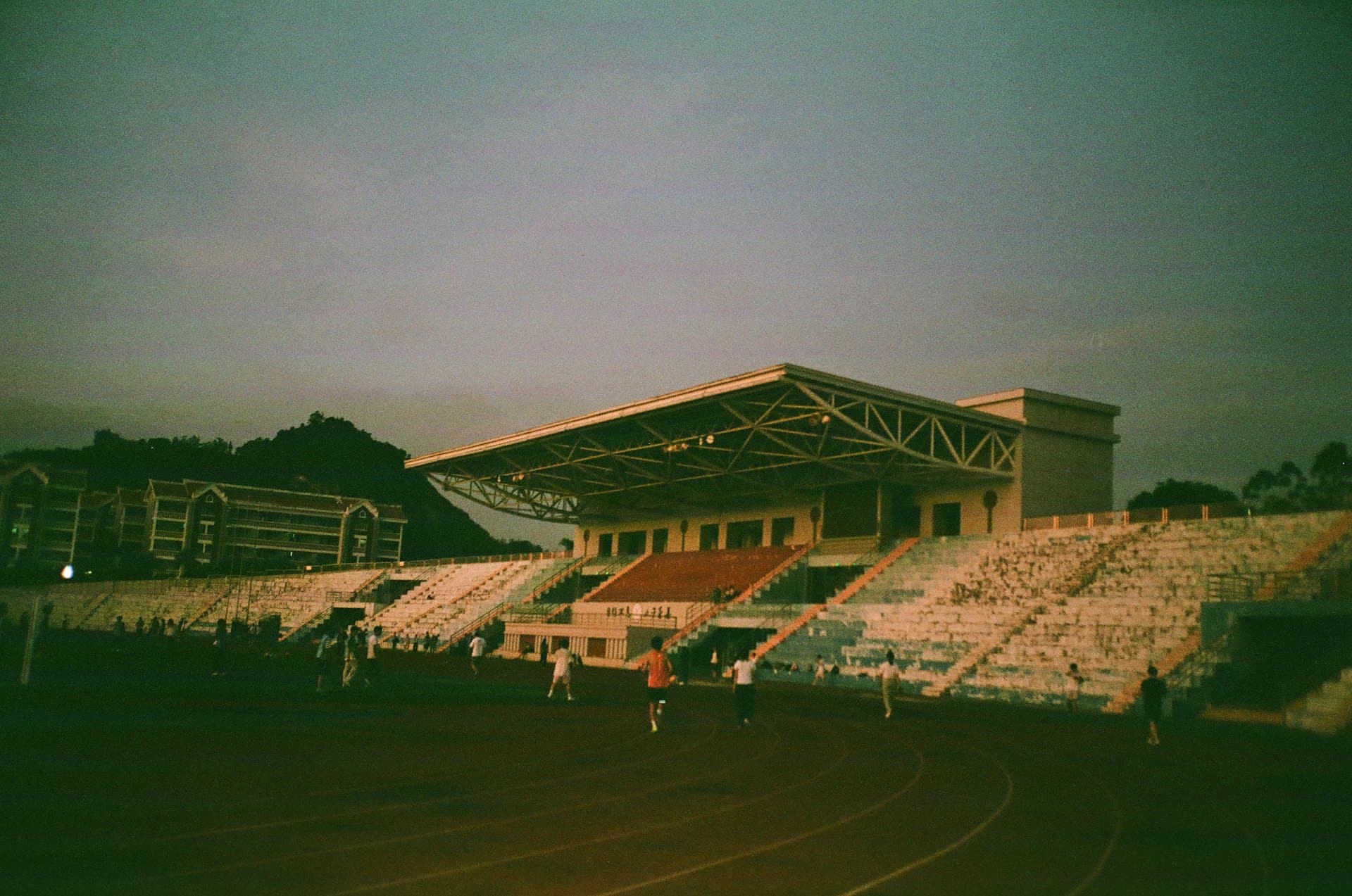 Athletes competing under floodlights